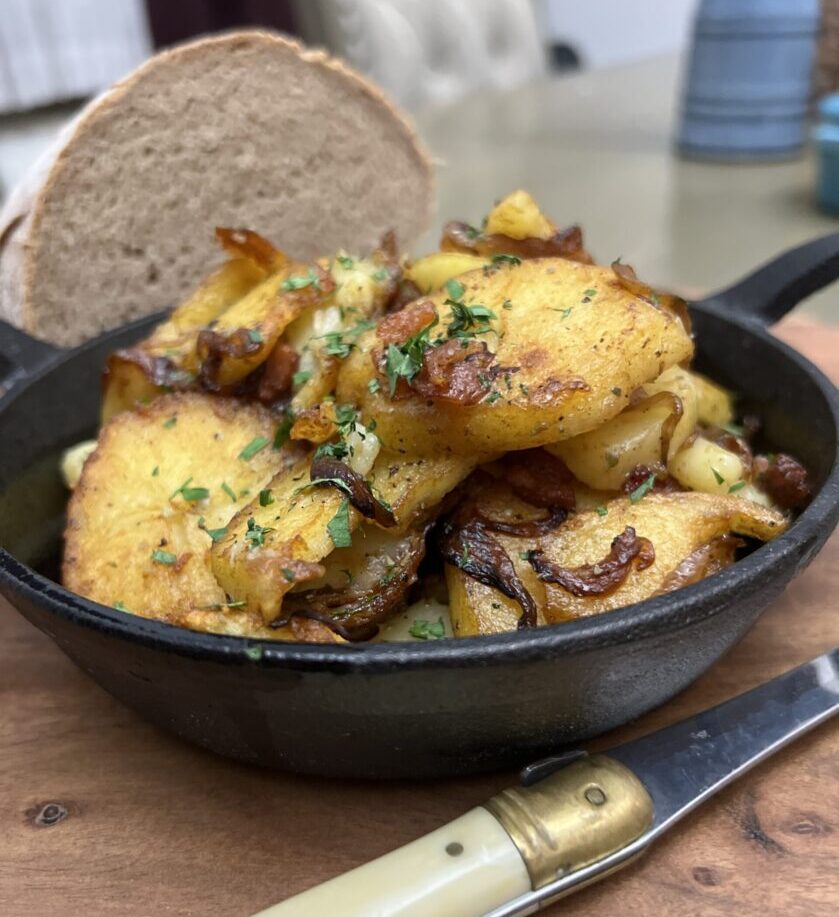 German fried potatoes in a cast iron pan.
